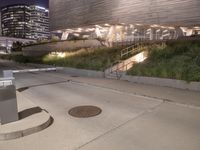 a manhole on the sidewalk next to steps and a city street light on it