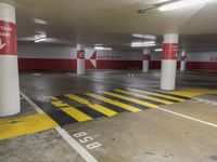 the car park has many lanes painted yellow and red, like this one for parking spaces