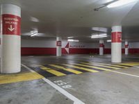 the car park has many lanes painted yellow and red, like this one for parking spaces