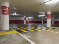 the car park has many lanes painted yellow and red, like this one for parking spaces