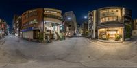 a fisheye lens captures the streets of a city at night time a man is on the street