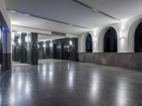 a subway station with an empty waiting area at night time to pick people up and get