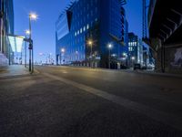 a long exposured photo of the city streets at night, and a car passes by
