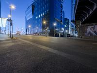 a long exposured photo of the city streets at night, and a car passes by