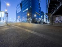 a long exposured photo of the city streets at night, and a car passes by