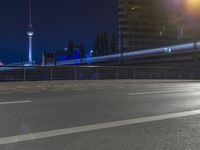 Nighttime Berlin Cityscape with Skyscrapers and Tower Lights