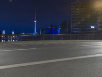 Nighttime Berlin Cityscape with Skyscrapers and Tower Lights