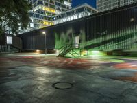 a parking lot with parking meter on the side of it at night under a canopy that lights up