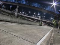 there is an image of the asphalt at night time in this photograph of a city street