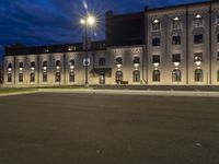 a car is parked in front of an empty building that has windows and a sign on the outside saying 6 thirty eight