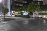 a city street with a sign stating the number 20 e on it's side