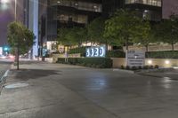 a city street with a sign stating the number 20 e on it's side