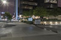 a city street with a sign stating the number 20 e on it's side