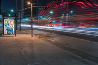 an american flag building with red and silver lights at night in a city street or street corner