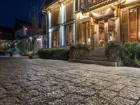 the cobblestones have some lights on in the dark and are illuminated by bright lights