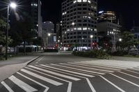 a night view of buildings and street lights, with a traffic light in the middle