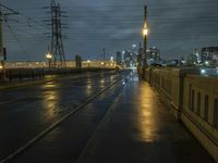 a night time scene of a flooded roadway with the lights on and dark and rainy sky