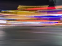 a motion blur photo of the night time scene of las vegas strip at las vegas