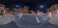 an 360 - angle shot looking down an empty city street, from a point of view