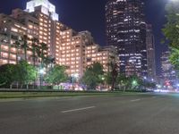 Nighttime in Los Angeles: A High-rise Skyscraper Amidst the City Lights