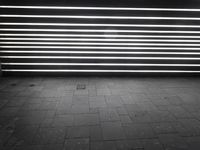 the light is glowing in the dark room beside a brick floor in this large area