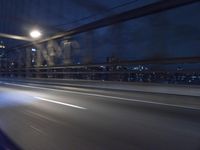 Nighttime New York City Skyline with the Manhattan Bridge