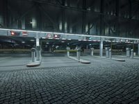 a parking lot with several signs lit up in the dark at night time's