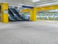 the empty car park with an escalator on the right and several escalators to either side