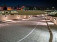 a view of a road and an overpass with traffic passing through it by buildings