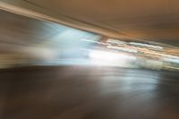 an abstract photograph of a skateboard on a street corner in motion with the camera going right to it