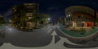 a 3d vision view of some buildings at night with arrows and buildings across the road