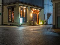 this is a shot of a restaurant at night with no one in it as if it is coming to the door