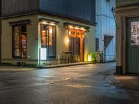 this is a shot of a restaurant at night with no one in it as if it is coming to the door