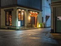 this is a shot of a restaurant at night with no one in it as if it is coming to the door