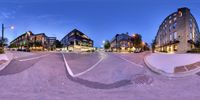 a 360 - vision photo of the empty street where people are going to see the city