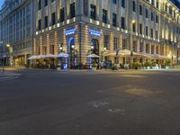 Nighttime View of Berlin Cityscape with Vibrant Neon Lights