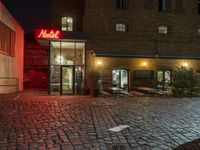 Nighttime View of Berlin's Urban Design with Neon Lights