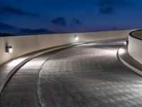 a view of a road and an overpass with traffic passing through it by buildings