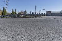 a person is on the side of an open road with skateboarder wearing headphones