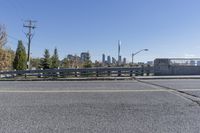 a person is on the side of an open road with skateboarder wearing headphones