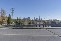 a person is on the side of an open road with skateboarder wearing headphones