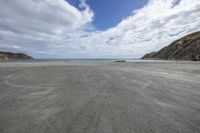 a person is riding his motorbike on the beach on a beautiful day with no clouds