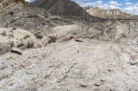 an image of the road is rocky and dirty and it looks rough and dusty and very rocky