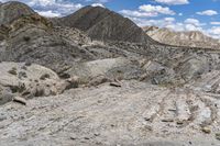 an image of the road is rocky and dirty and it looks rough and dusty and very rocky