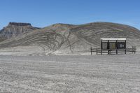 a red truck is driving through the rocky landscape of the desert of an arid area