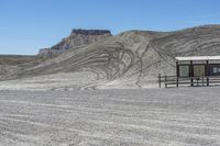 a red truck is driving through the rocky landscape of the desert of an arid area