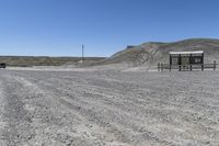 a red truck is driving through the rocky landscape of the desert of an arid area