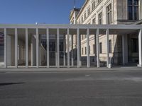 the building with pillars has a lot of columns on each side of it, all in two different directions