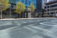 a fire hydrant in front of an office building with glass doors and windows on a sunny day