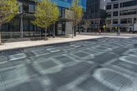 a fire hydrant in front of an office building with glass doors and windows on a sunny day